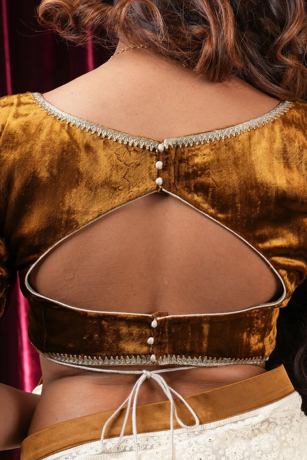 Amber velvet sweetheart neck blouse with lace detailing.